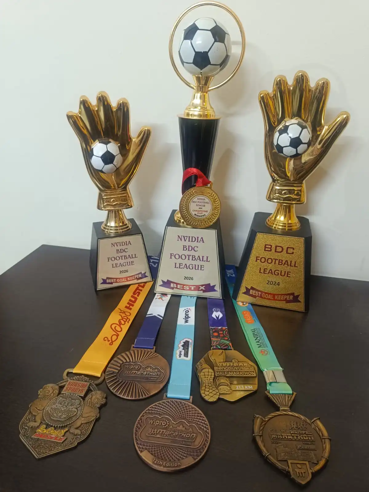 Sakshat Rao receiving awards at various football tournaments & half-marathon runs