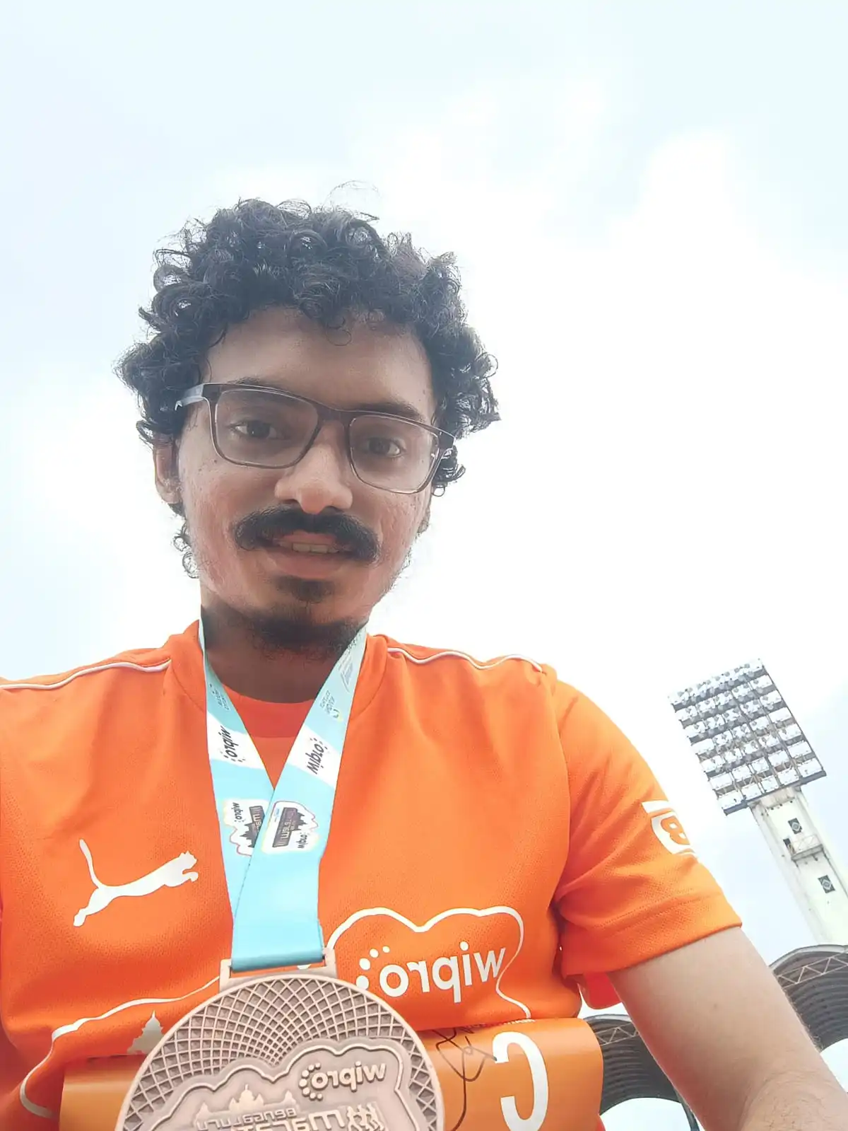 Sakshat Rao at half marathon finish line - 21km running achievement